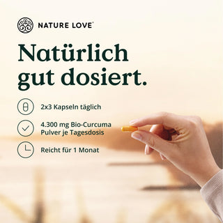 Eine Frau hält eine Tablette mit der Aufschrift „Nature Love“ in der Hand, die die Vorteile von Bio-Curcuma-Kapseln verdeutlicht.