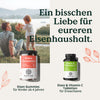 Ein Mann bietet einem Mädchen im Freien einen Apfel an. Im Vordergrund ist das „Eisen – Family-Set“ von Nature Love für Kinder und Erwachsene zu sehen. Darüber ist ein deutscher Text zu lesen.