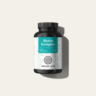 Eine Dose Biotin Komplex Tabletten von Nature Love auf weißem Hintergrund.